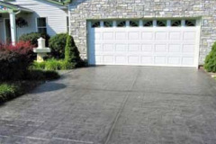 Grey resurfaced concrete driveway