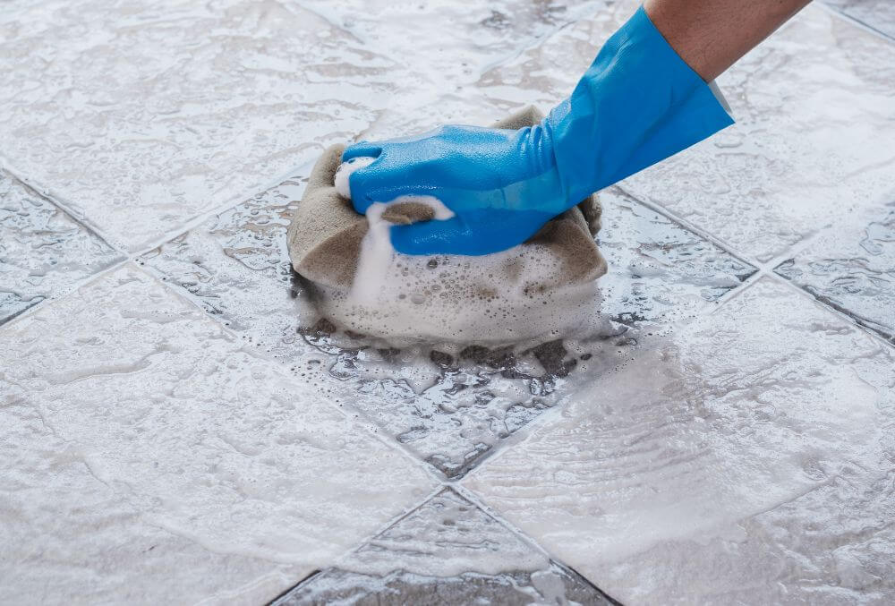 brushing the floor with detergent