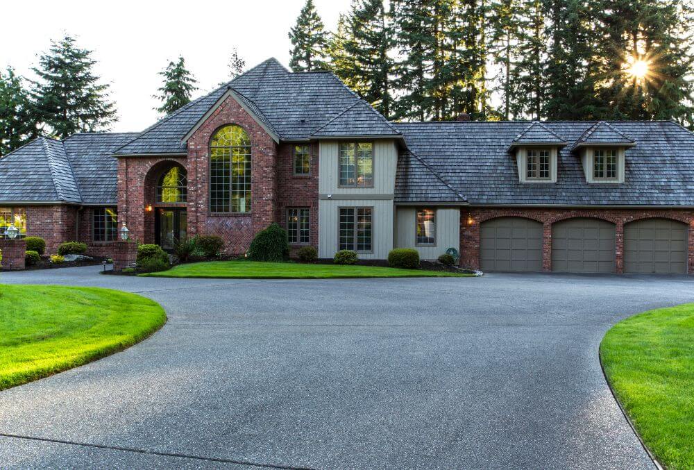 country house with concrete driveway apron