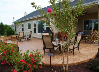 porch with beautiful flowers and a garden chair