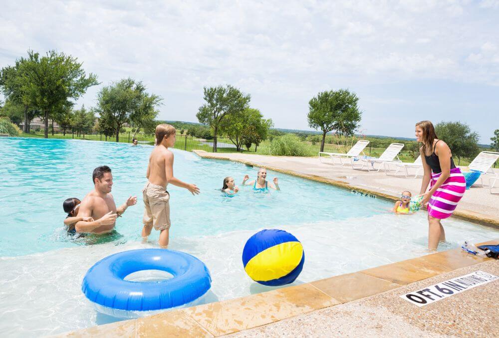 family is having a fun time at the swimming pool