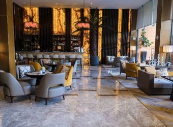 hotel lobby with chairs and tables