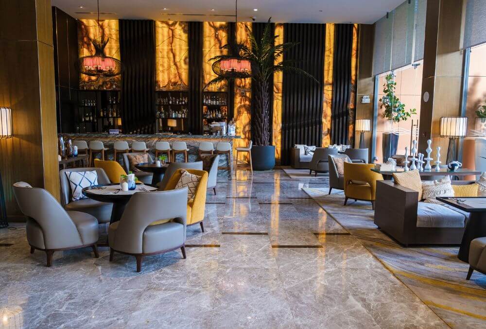 hotel lobby with chairs and tables