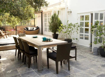 Outdoor dining area with plants candles