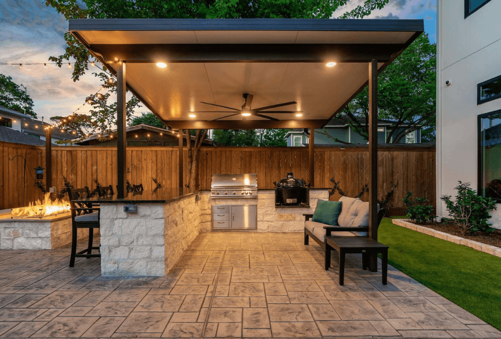 extended concrete patio with couch and a firepit