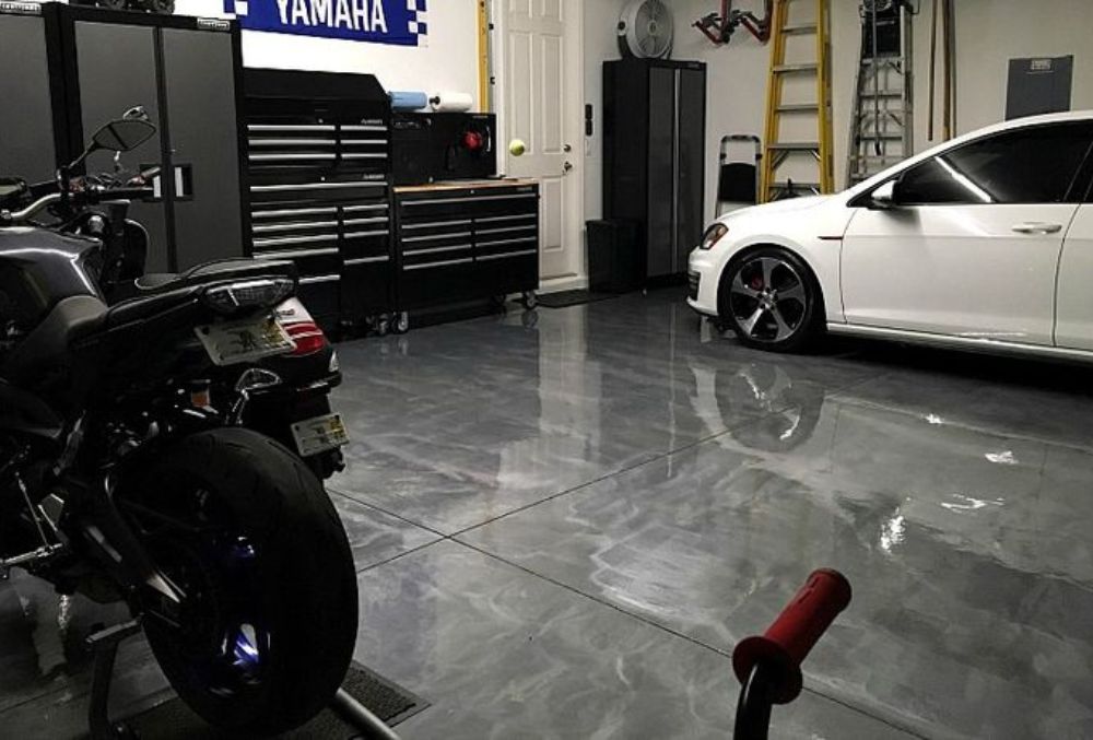 Epoxy garage floor Kansas City installation showing durable, glossy surface by local contractors.