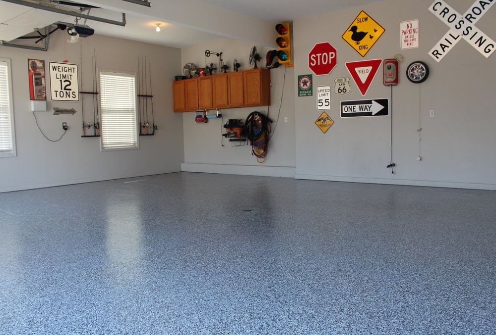 Sleek polyurea polyaspartic garage flooring in Kansas City, highlighting high-gloss texture and modern design.